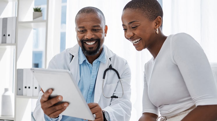 Doctor and patient reviewing paperwork